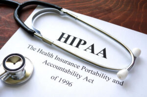 Stethoscope resting on a printed page reading HIPAA, The Health Insurance Portability and Accountability Act of 1996